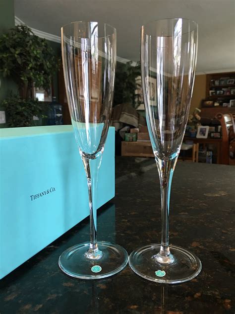 The inner box and <b>flutes</b> are in perfect condition and have never been used. . Tiffany and co champagne flutes
